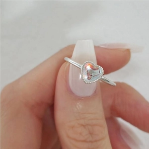 Elegant 925 sterling silver ring with a heart-shaped iridescent colorful stone on hand