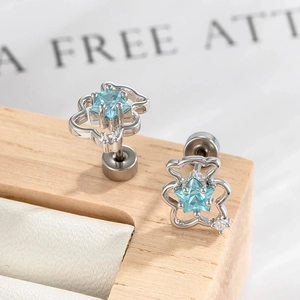 Silver bear cartilage earrings with blue star zircon and secure screw back clasp