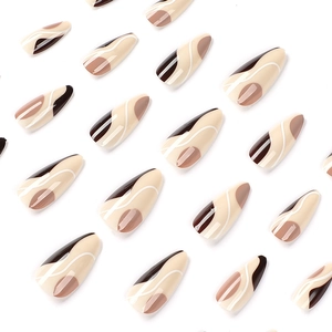 Press on nails with brown and cream abstract line art in medium almond shape