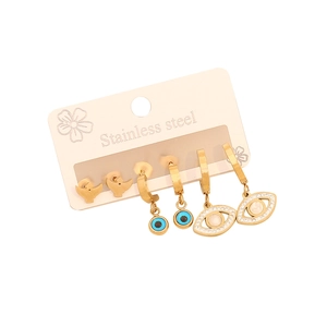 Trois paires de boucles d'oreilles dorées en acier inoxydable avec pendentifs œil