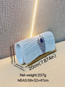 Elegant light blue evening clutch with peacock brooch and dimensions 20x10x6cm
