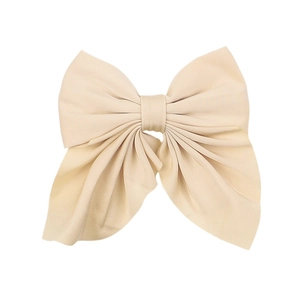 Large beige fabric bow hair clip with ribbons on white background for women