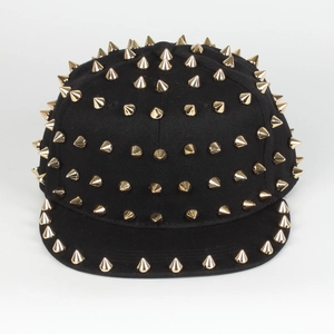 Front view of black flat brim hip hop hat with golden cone metal rivets and spikes