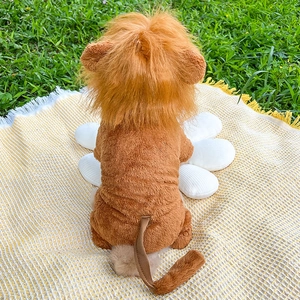 Close-up of a brown plush lion mane costume for dogs and cats on a green outdoor lawn