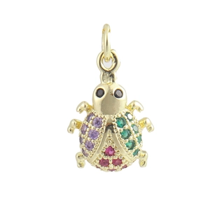 Detailed close-up of a golden ladybug pendant inlaid with vibrant purple and green zircons