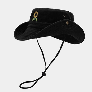 Detail of black cotton sun hat with sunflower embroidery and adjustable chin strap