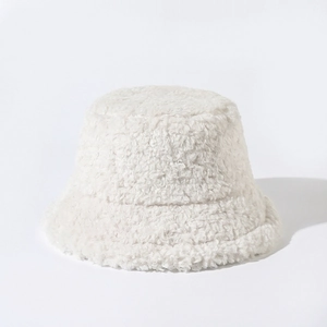 Close-up detail of a soft white plush bucket hat for women winter warm accessory