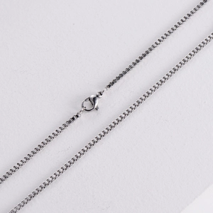 Silver stainless steel box chain necklace with lobster clasp shown on white background