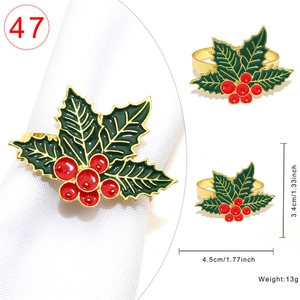 Gold Christmas holly leaf napkin ring with red berries for festive dining decor