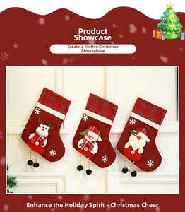 Three Christmas stockings featuring Santa, snowman and reindeer on red burlap material