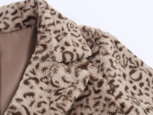 Macro shot of faux fur texture and leopard print lapel on a stylish long winter coat