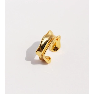 Minimalist irregular fluid wave open gold ring with a polished metallic finish on white