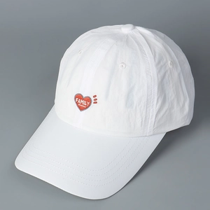 Detailed close-up of white breathable baseball cap with red embroidered FAMILY heart logo