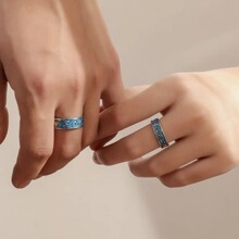 Detail of adjustable gold-plated stainless steel leaf rings worn on hands