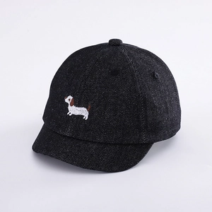 Close-up of the cute dog embroidery on a black denim baseball cap for toddlers