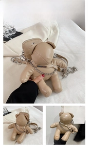 Macro detail of the khaki PU bear crossbody bag featuring a durable gold metal chain strap