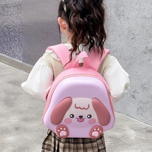 Pink and purple cartoon puppy hard shell backpack for toddlers in outdoor setting