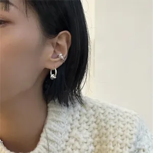 Detail of 925 sterling silver hoop earrings with bow ear cuff and pearl clip on model