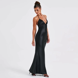 Detailed view of backless black satin evening dress with elegant floor-length drape