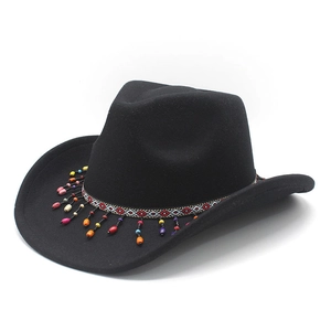 Detail of western cowboy hat with colorful ethnic beads and geometric ribbon band