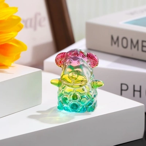 Detail of colorful gradient crystal sheep figurine with honeycomb texture and transparent finish