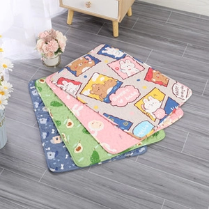 Folded pet blankets in blue, green, pink and beige with cute animal prints on wood floor