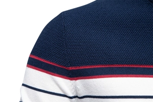 Detailed close-up of knit texture and striped seams on men's navy and red sweater