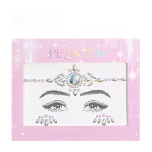 Macro view of AB acrylic rhinestones and white pearls face jewels in crown design