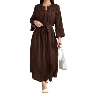 Detail of dark brown V-neck dress with textured fabric and matching waist tie belt