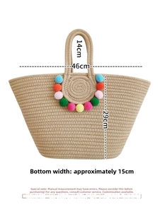 Detail of handmade straw tote bag with rainbow pom-poms and dimensions 46x29x15 cm