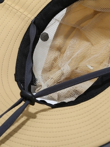 Outdoor sun hat with breathable mesh lining, sweatband and adjustable windproof cord
