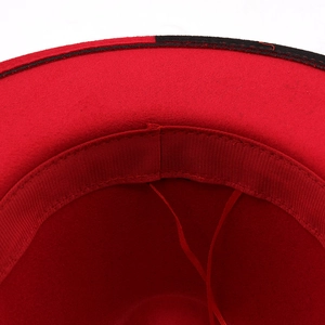 Detail of red wool felt fedora interior with black sweatband and adjustable drawstring