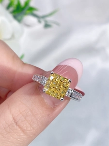 Macro close-up of a s925 silver ring featuring a yellow square-cut carbon diamond stone