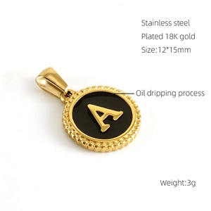 Detailed view of 18K gold plated stainless steel letter A pendant with black oil drip