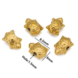 Detailed view of turtle-shaped golden beads with size dimensions 8.5x6mm and 1.5mm hole