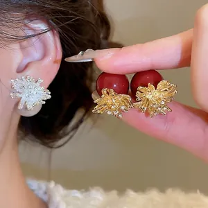 Elegant floral fireworks earrings with shimmering crystal accents and pearl drop charms