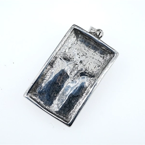 Retro punk style silver square pendant necklace with demon eye skull textured design