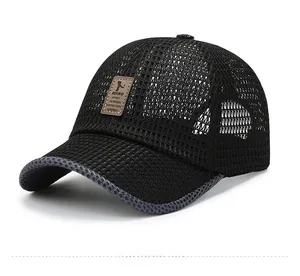 Detail view of a breathable black mesh baseball cap featuring a premium brown leather logo patch