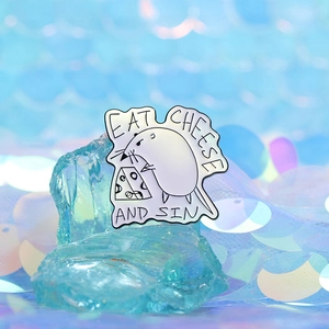 Cartoon enamel pin featuring a mouse eating cheese with Eat Cheese and Sin text