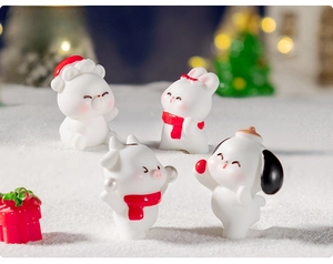 Detailed macro view of four mini Christmas resin animals on a snowy DIY landscape