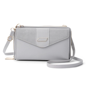 Gray synthetic leather mini crossbody bag with flap magnetic closure and dual zippers