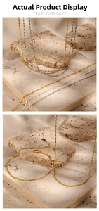 Macro shot of minimalist gold and silver S925 sterling silver square tile chains