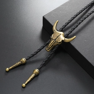 Vintage bronze bull skull bolo tie with black braided PU leather cord and metal tips