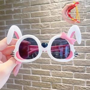 Detail of flexible white bunny sunglasses for kids showing the bendable frame feature