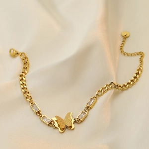 Elegant gold-plated butterfly bracelet with cubic zirconia stones on silk fabric