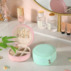 Portable round jewelry box in pink and mint green PU leather with zipper closure
