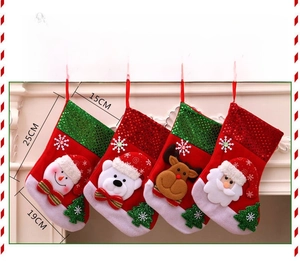 Detail view of sequined Christmas stockings with snowman and Santa patterns 25cm height