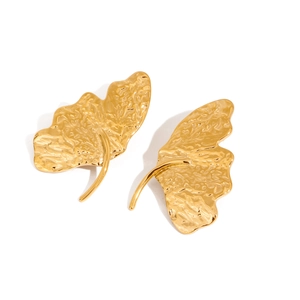 Golden textured ginkgo leaf earrings in titanium steel for a minimalist fashion look