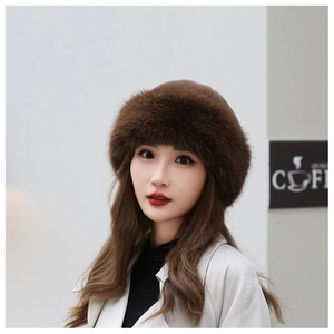 Detailed texture of thick dark brown faux fur on a warm winter Mongolian style hat