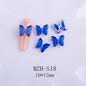 Detail view of 10x12mm blue crystal butterfly nail charm with silver base and dimensions
